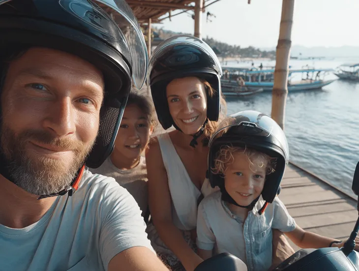 Family Trip to Secret Beach – Older children wearing non-slip water shoes exploring the rocky shoreline.