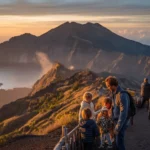 Mount Batur Sunrise Trek in Bali 2026 – A professional babysitter helping a child on a steep trail.