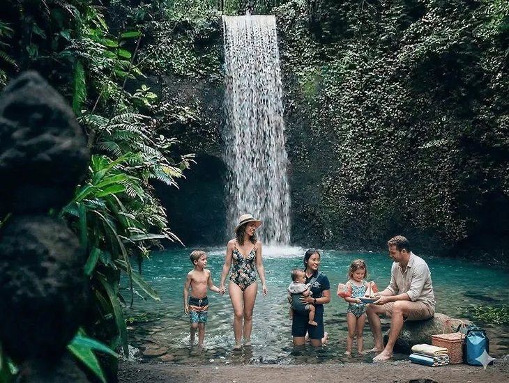Tibumana Waterfall in Bali 2026 – A dedicated babysitter organizing a water-time kit with dry towels and snacks.