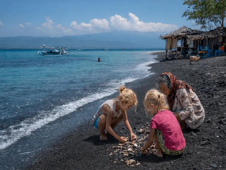 Amed Sitter Services 2026 – Child safety supervision, volcanic sand play activities, and professional travel childcare for families in Karangasem.