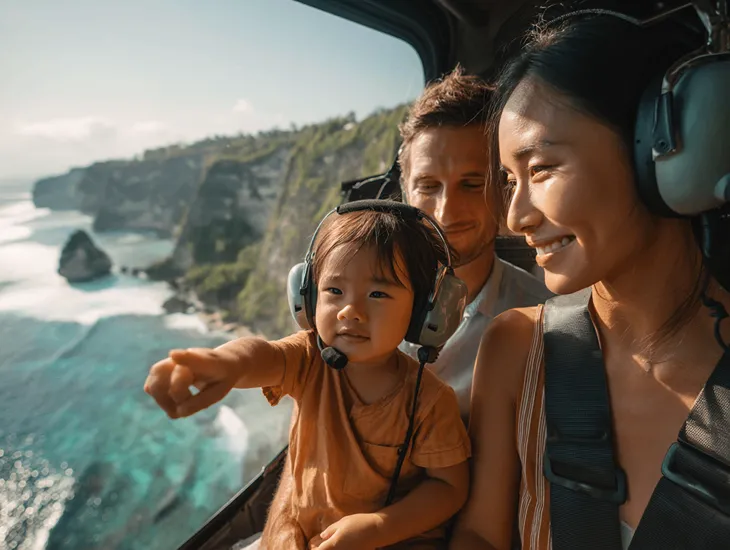 Bali Coastal Flight 2026 - An aerial view of the Uluwatu cliffs from the window of a helicopter.