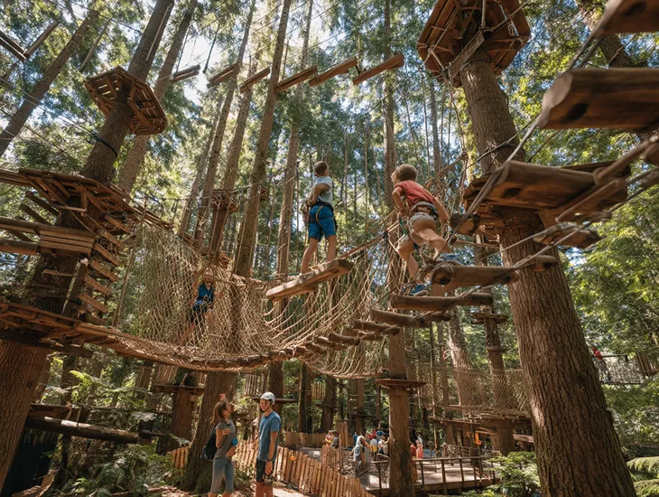 Bedugul Canopy Obstacles 2026 - A child standing near a colorful height measurement board.