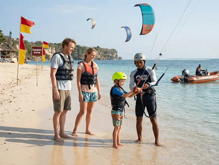 Kite Surfing Lessons in Bali 2026 – Family safety gear, IKO certified training, and windsurfing activities for children.