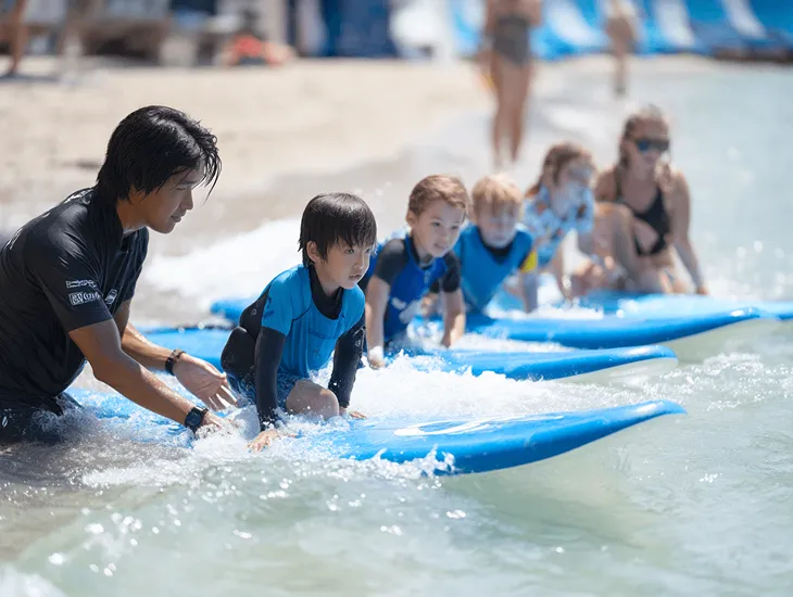 Kid-Friendly Beaches in Bali at Batu Bolong Canggu with teen paddleboarding, surf lessons, and family beach cafes