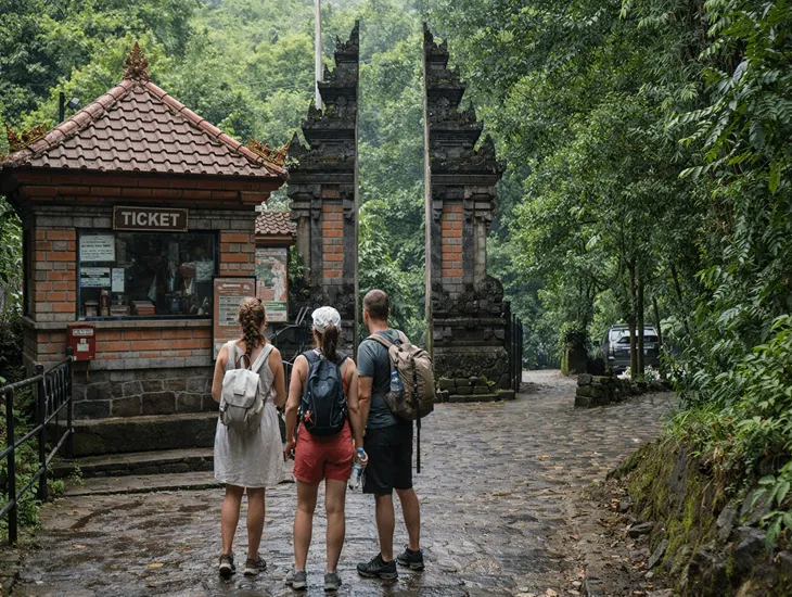 Gitgit Twin Falls 2026 – A professional Babysitter in Indonesia helping children at a ticket booth.