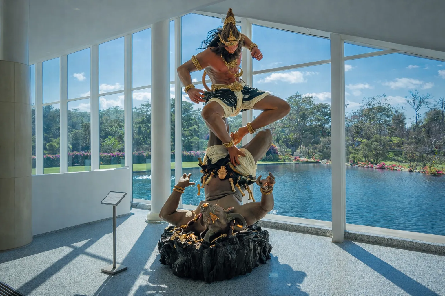 Balinese Traditional Art 2026 – A babysitter in Indonesia showing giant ogoh-ogoh sculptures to children in a museum setting.