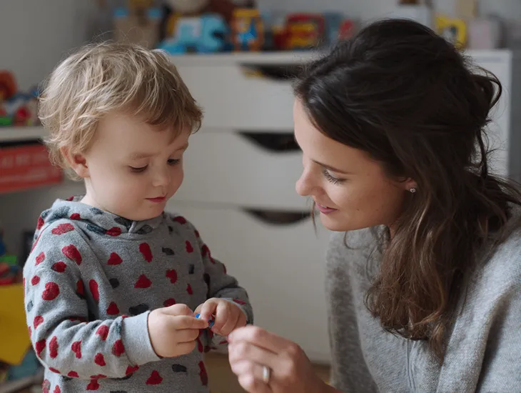 Early Language in Bali 2026 – Childcare professional practicing Indonesian words with an expat child