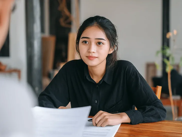 Fake Babysitter Profiles in Bali 2026 – Mother calling a reference to verify caregiver work history