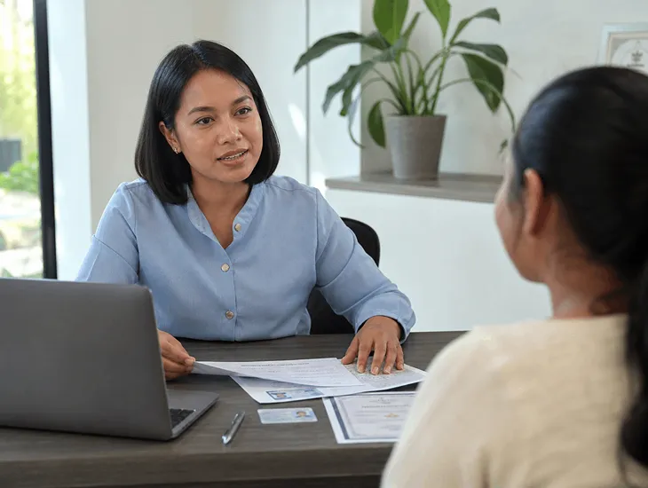 Wage for a Babysitter in Bali 2026. Agency staff conducting a background check and interview.