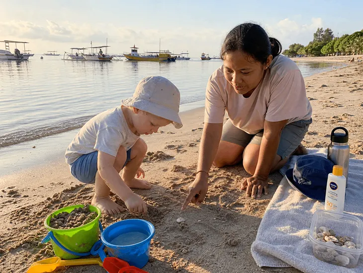 Toddler Outdoor Play in Bali 2026 – Sanur Beach offers calm water, soft sand, shell sorting, and safe water play with a dedicated babysitter for gentle sensory exploration